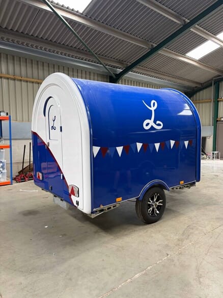 An image of a wrapped school food trailer.